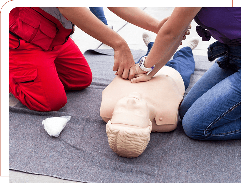 A person is performing cpr on an infant dummy.