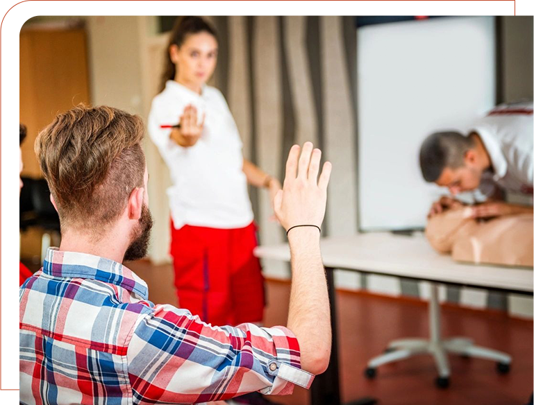 A man and woman are in front of a projector screen.