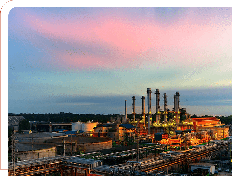 A large industrial area with many pipes and buildings.