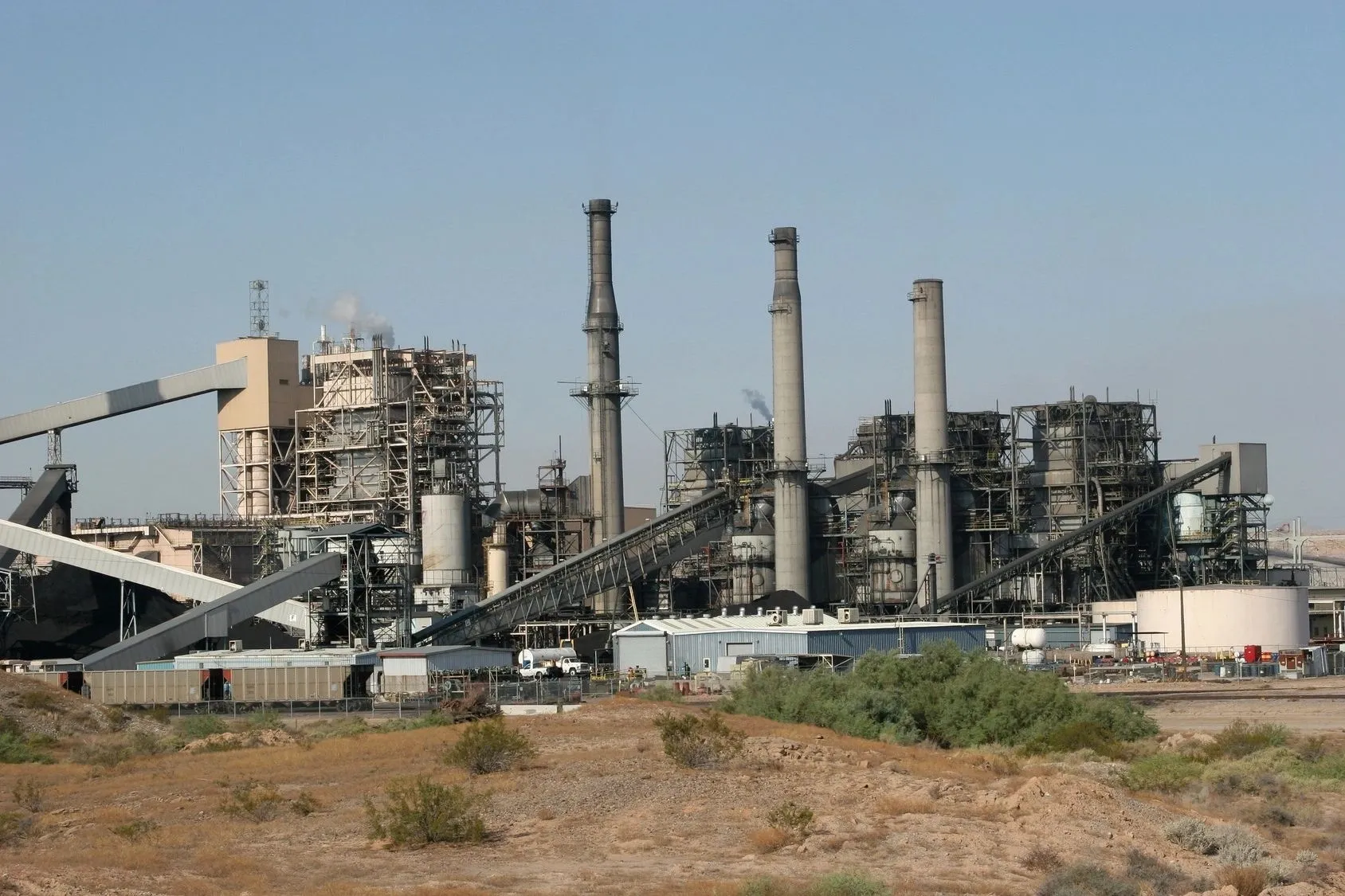 A large industrial area with many pipes and stacks.