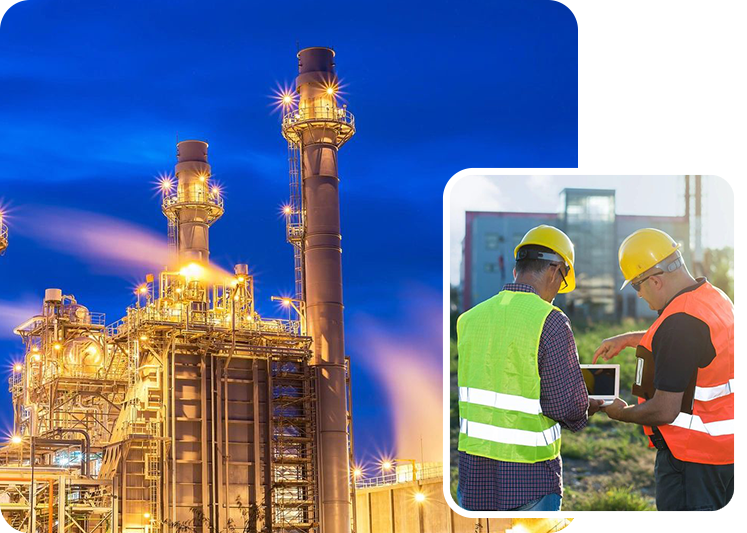 A man in yellow vest holding laptop next to an oil refinery.